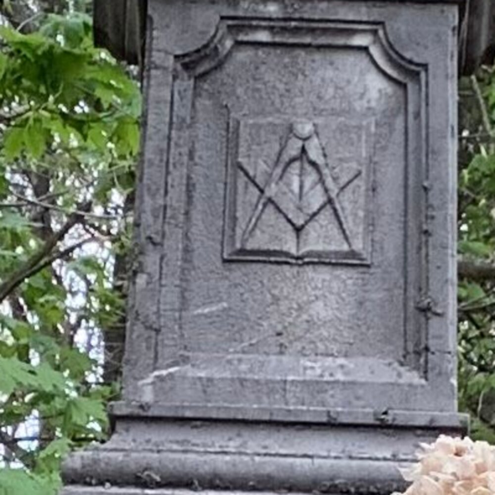 The carved square and compasses on the Bradford monument at Pine Grove Cemetery