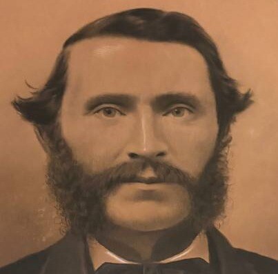 Detail of the charcoal portrait found in the house: a bearded man of the 1870s